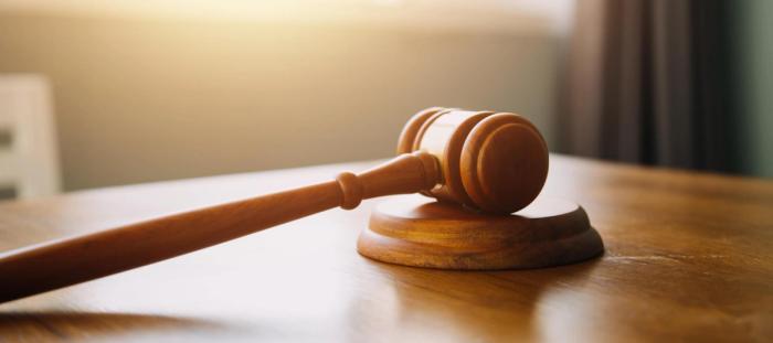 A gavel on a wooden desk