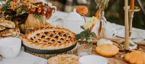 A table laden with Autumn decor and pastries