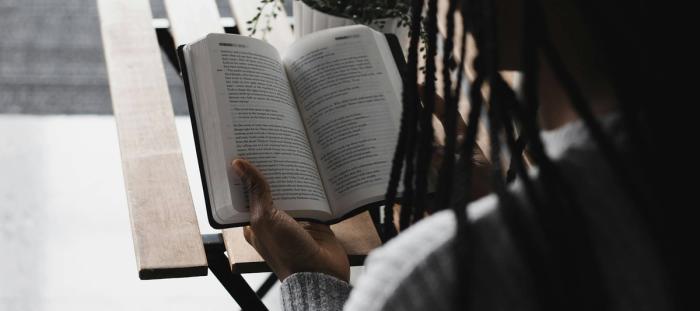 A woman reading a Bible