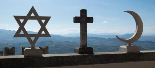 Statues of the Star of David, a cross, and a crescent moon aligned together