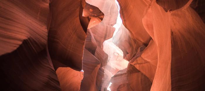 light coming through tan canyon of rocks