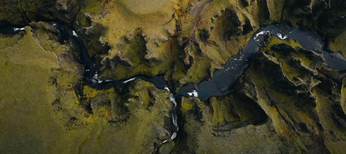 a river winding through green hills