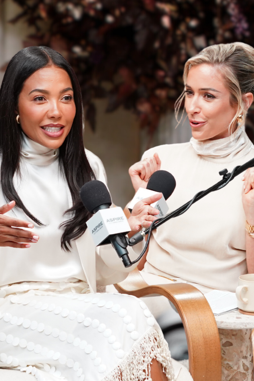 Kristin Cavallari and a woman with dark hair speaking into microphones, both in light-colored attire, with event title "Choosing Enough Over More."