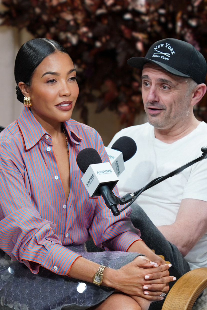 A woman in a striped shirt and a man in a baseball cap speak into ASPIRE microphones.