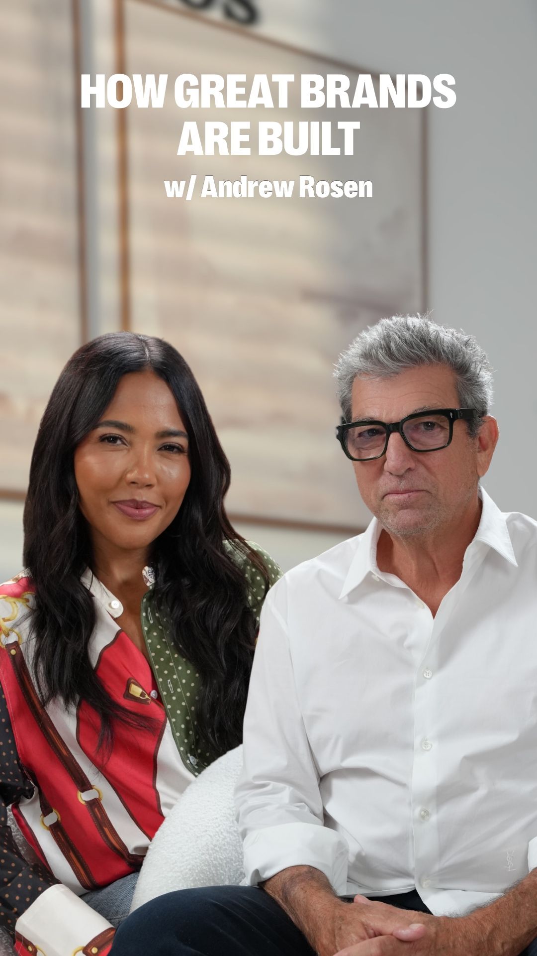 A smiling woman and a serious man in glasses sit under the text "HOW GREAT BRANDS ARE BUILT w/ Andrew Rosen".