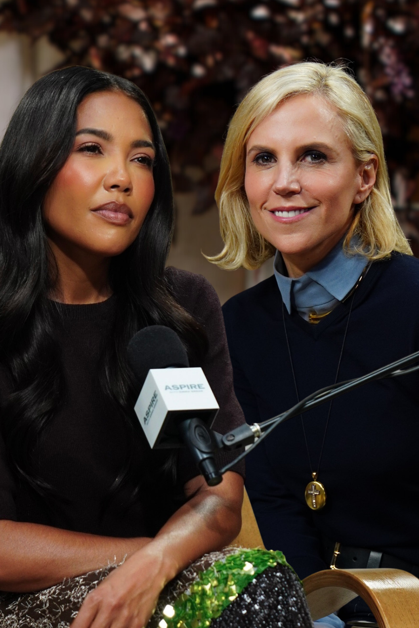 Two women being interviewed: one with long dark hair looking left, and one with a blonde bob smiling, with an ASPIRE microphone between them.
