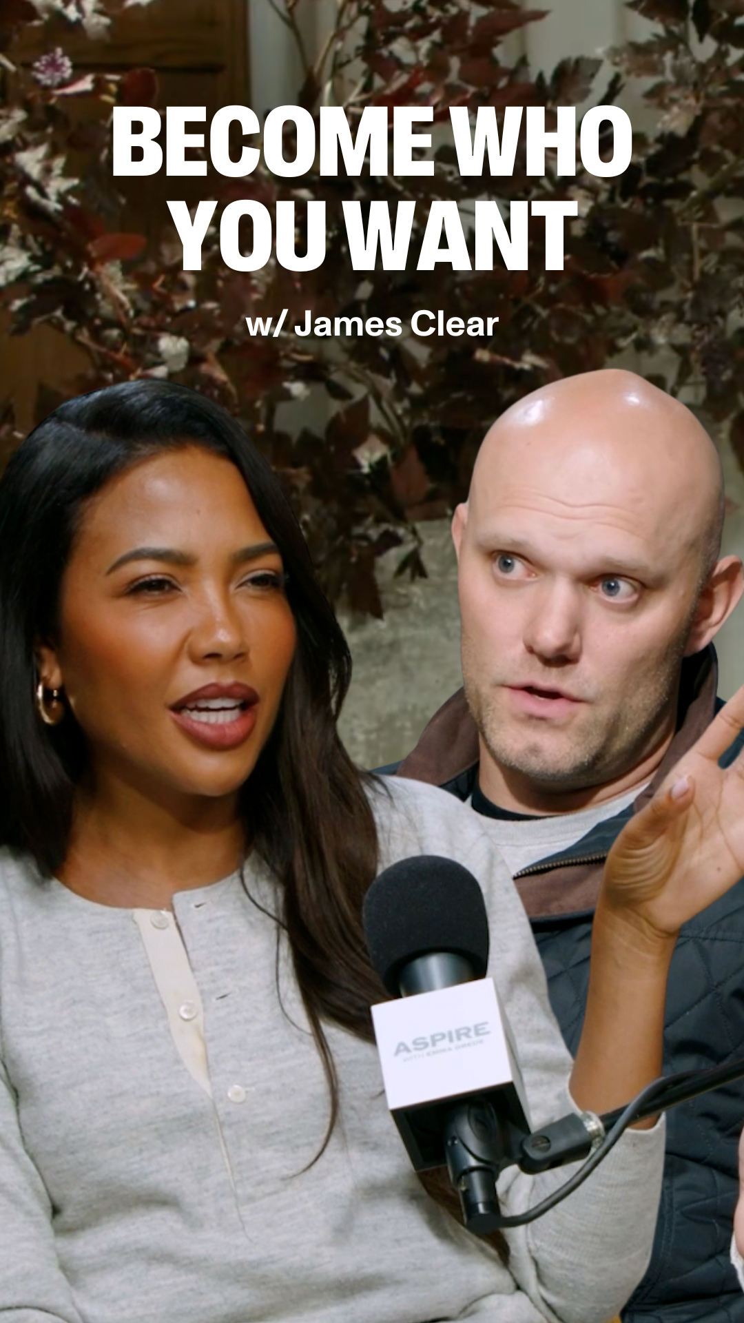 A woman Emma Grede speaks into a microphone next to a bald man James Clear, with text "BECOME WHO YOU WANT w/ James Clear" above them.