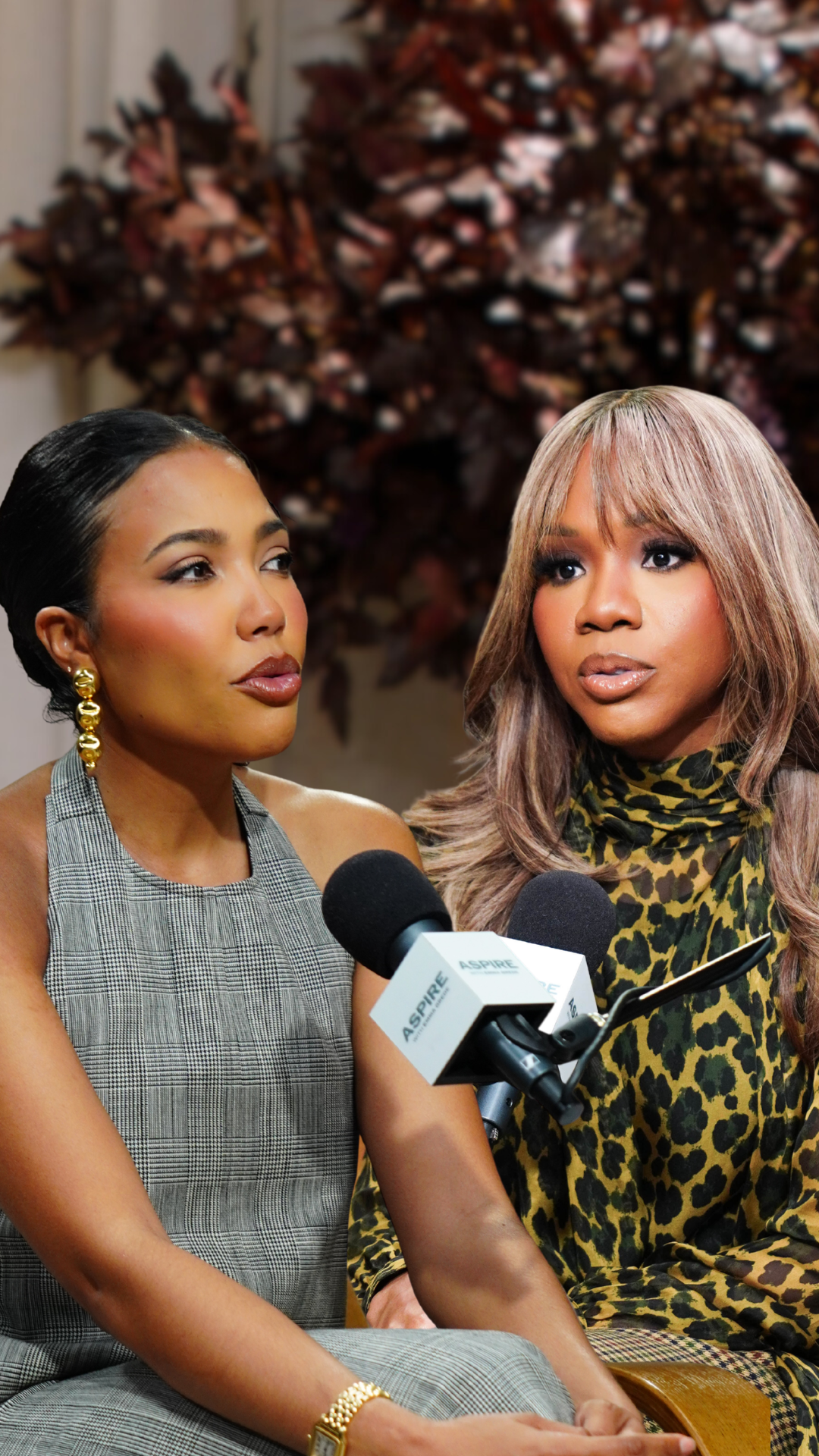 Two women, one in a plaid top and one in a leopard print top, are being interviewed with microphones.