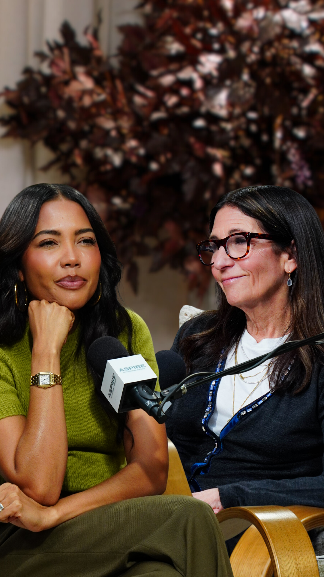 Emma Grede and Bobbi Brown seated, engaged in conversation with microphones.