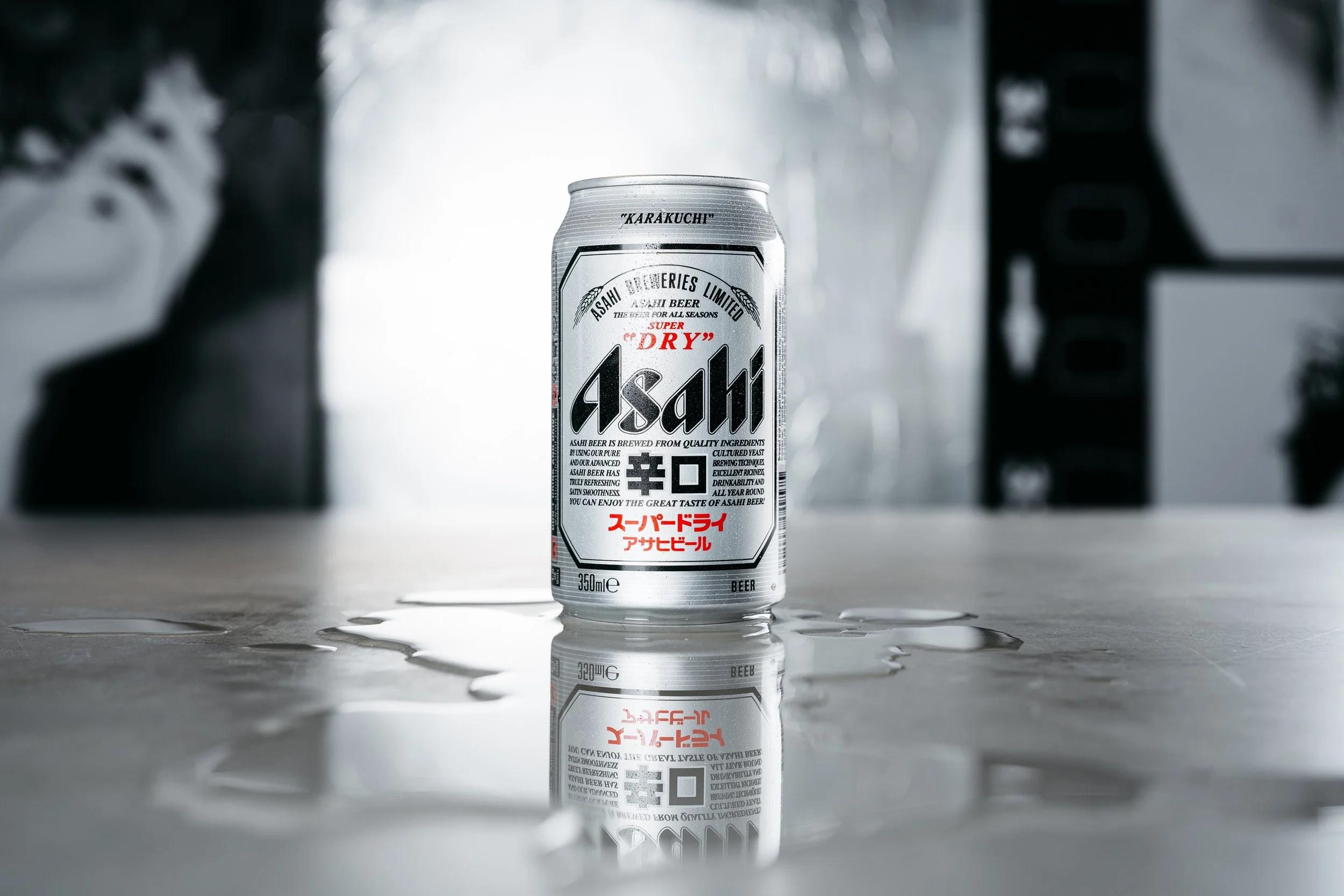Asahi Super Dry aluminum can showcasing minimalist typography and precision lettering as part of its premium beer branding system.