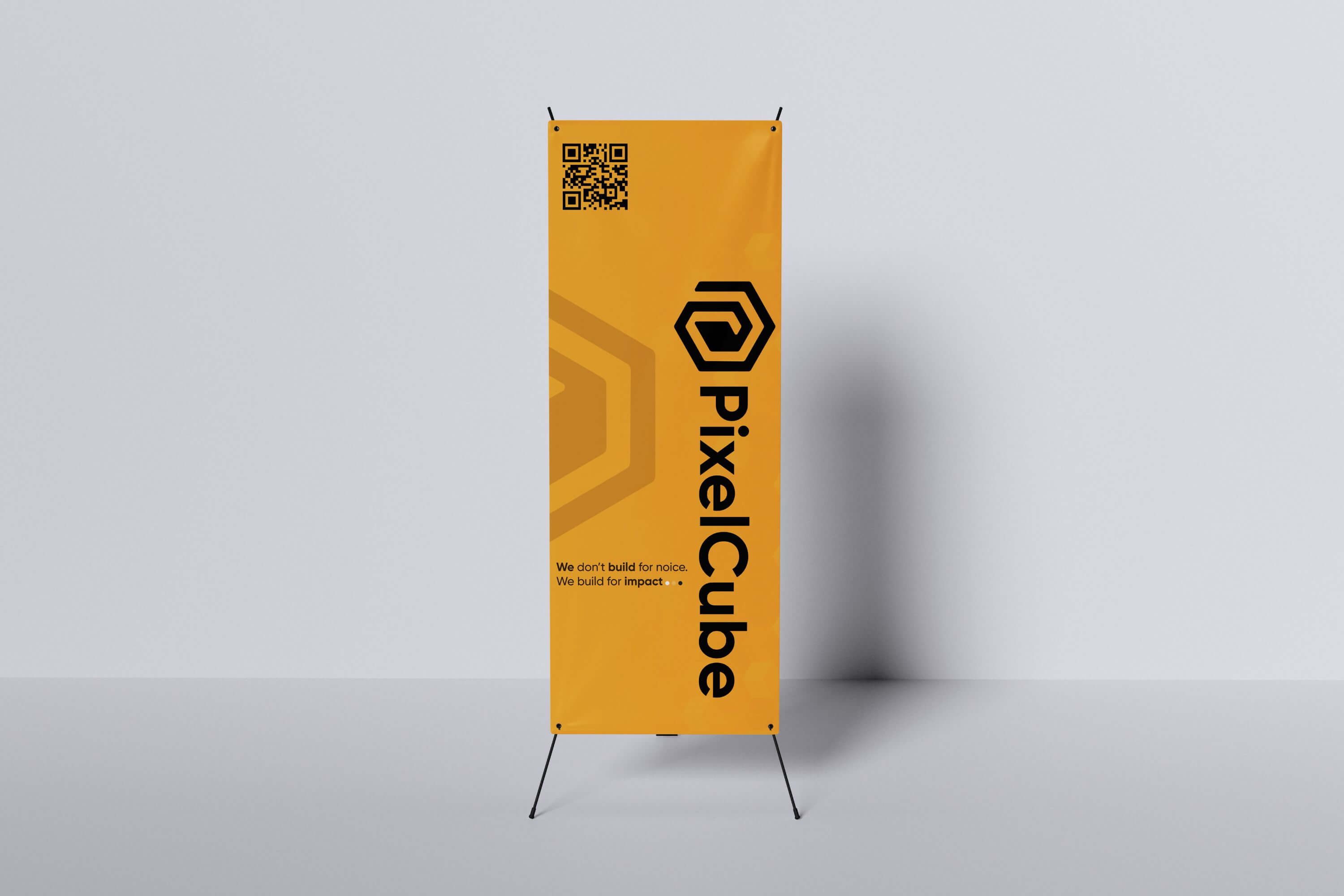 Gold-themed PixelCube corporate X-banner featuring vertical logo placement, QR code, and minimalist branding.
