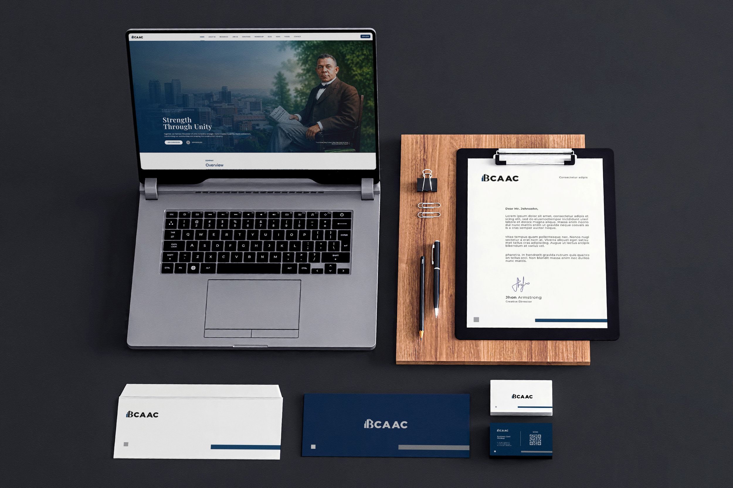 Corporate stationery presentation for BCAAC featuring a website, letterhead, business cards, envelope, clipboard, and branded office materials.