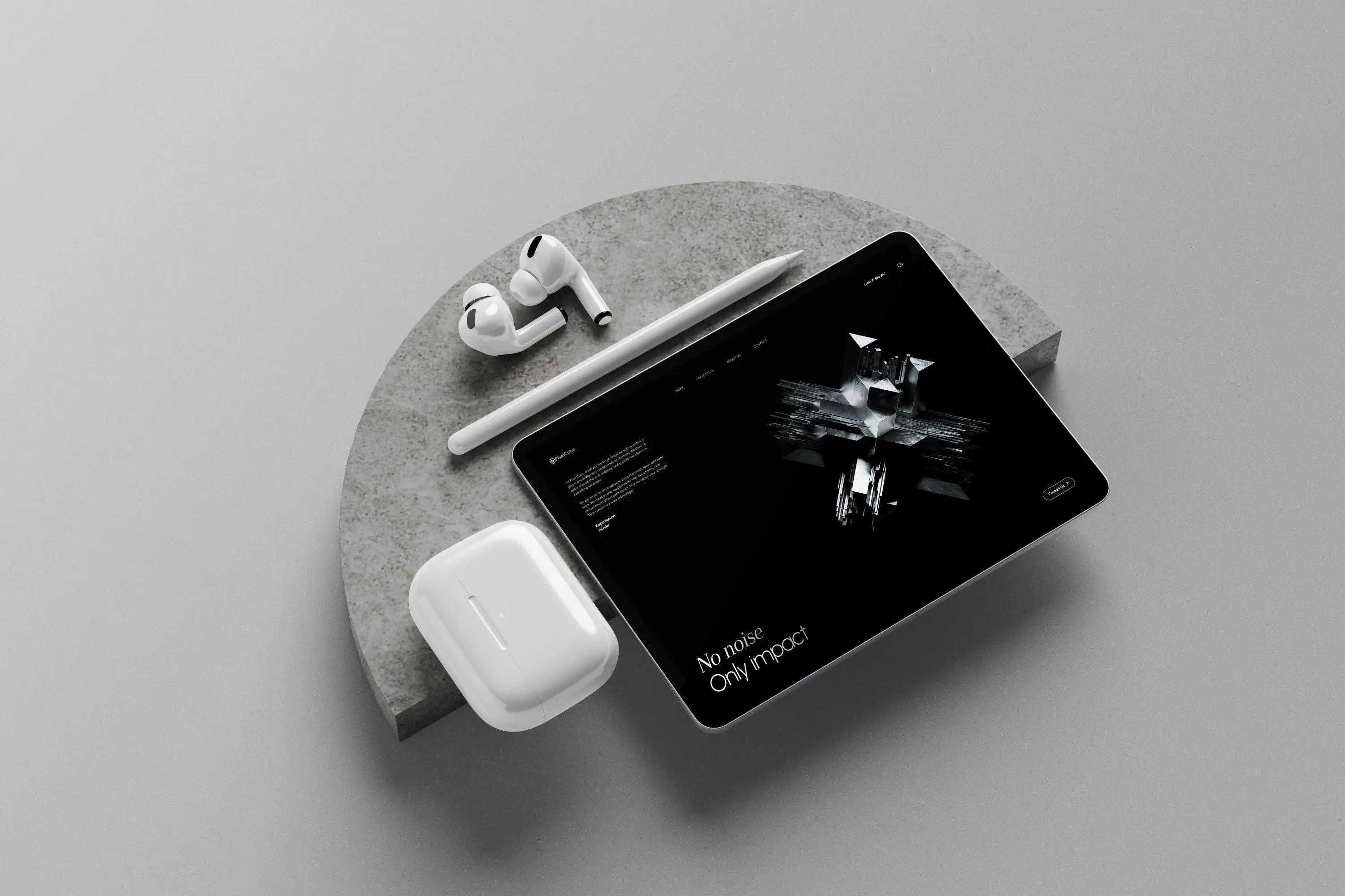 Minimal website presentation displayed on an iPad with Apple Pencil and AirPods in a premium monochrome mockup.