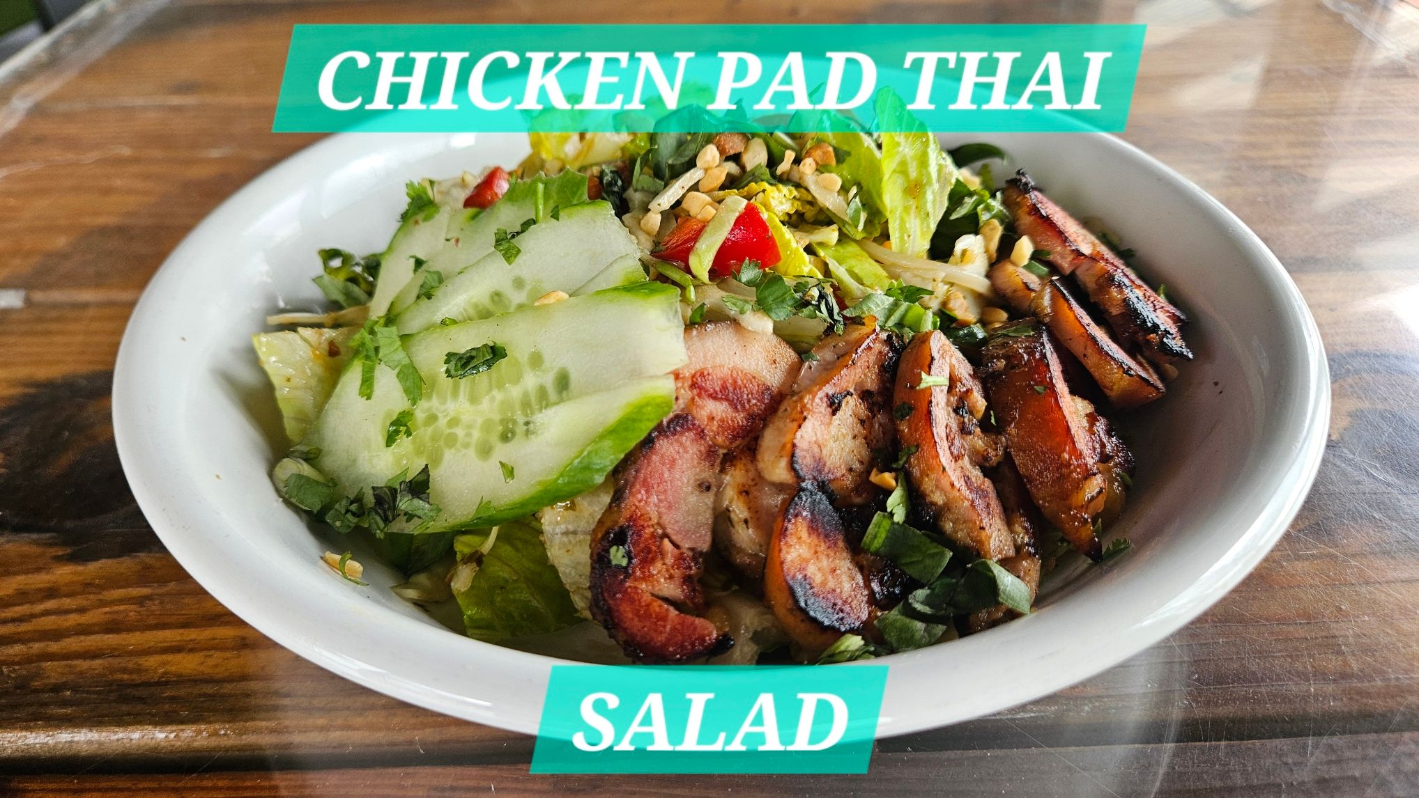 Chicken pad thai salad with cucumber, peanuts and grilled chicken