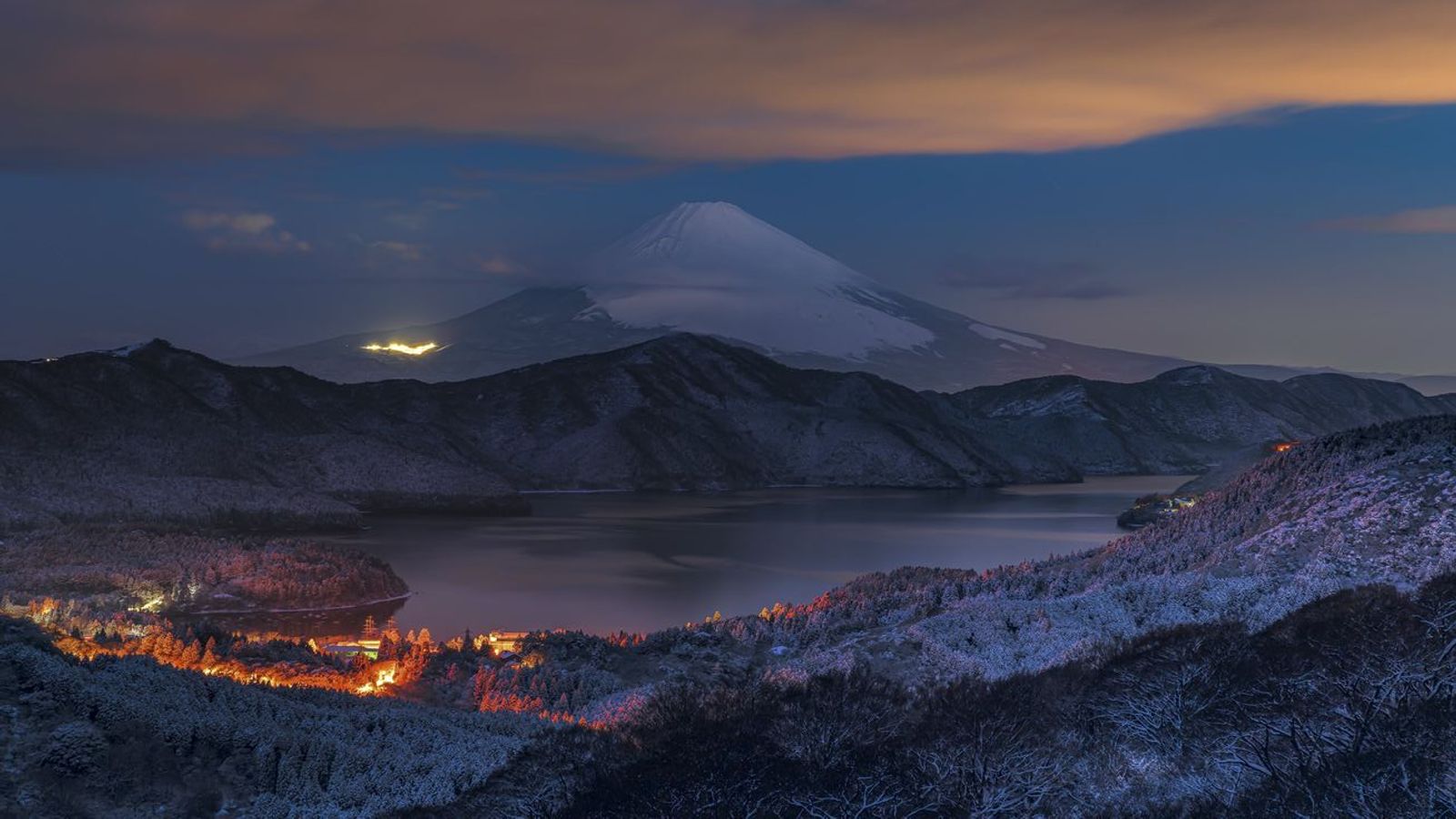 Person inspecting a used car before buying