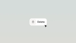 A computer cursor hovers over a rounded white button labeled “Delete” with a trash can icon on a light gradient background.