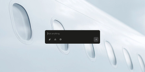 A sleek chat input box with the prompt “Ask anything” floats over a blurred close-up of airplane windows on a light, minimalist background.