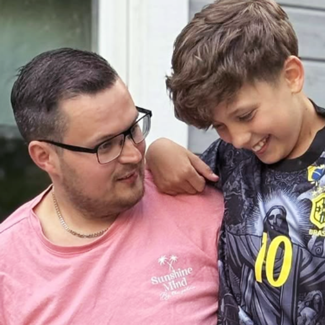 a boy wearing a shirt with the number 10 on it