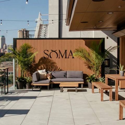 Couples dining on a beautiful outdoor patio at Utica Square, upscale casual date night ideas in Tulsa, local singles activities