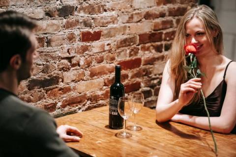 women, sniffing rose, dating, events, showing up alone, advice
