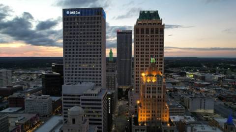 Sunset views of downtown Tulsa buildings, Beyond The Sparks compatibility matching and singles events at Cabin Boys Brewpub