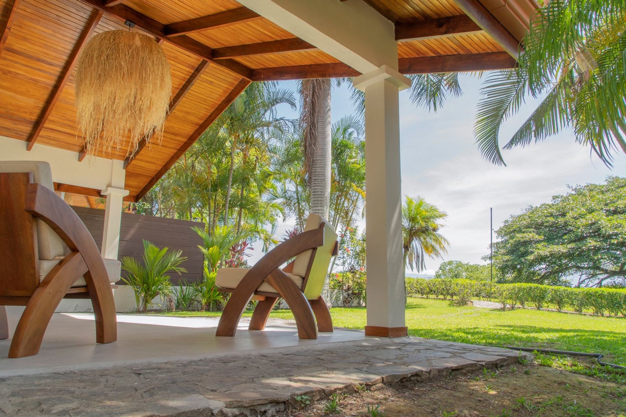 Outdoor terrace with seating and a view across the valley.