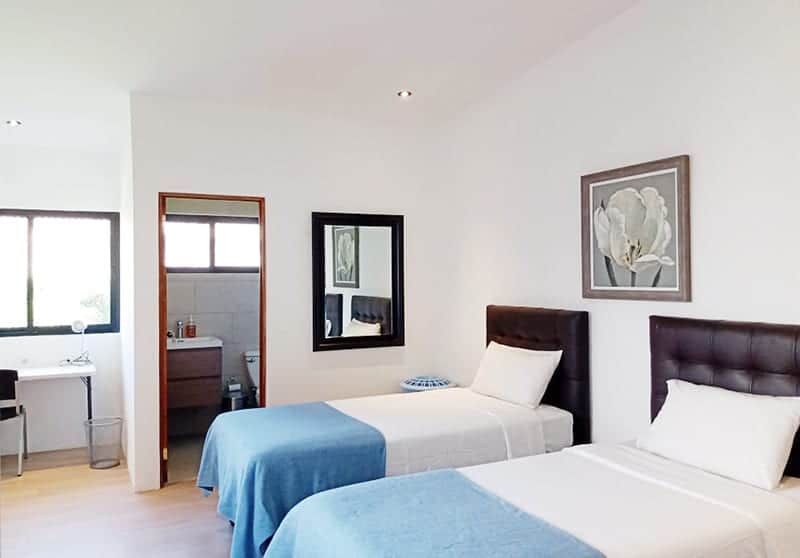 Spacious room with wood ceiling and a quiet corner for reading.
