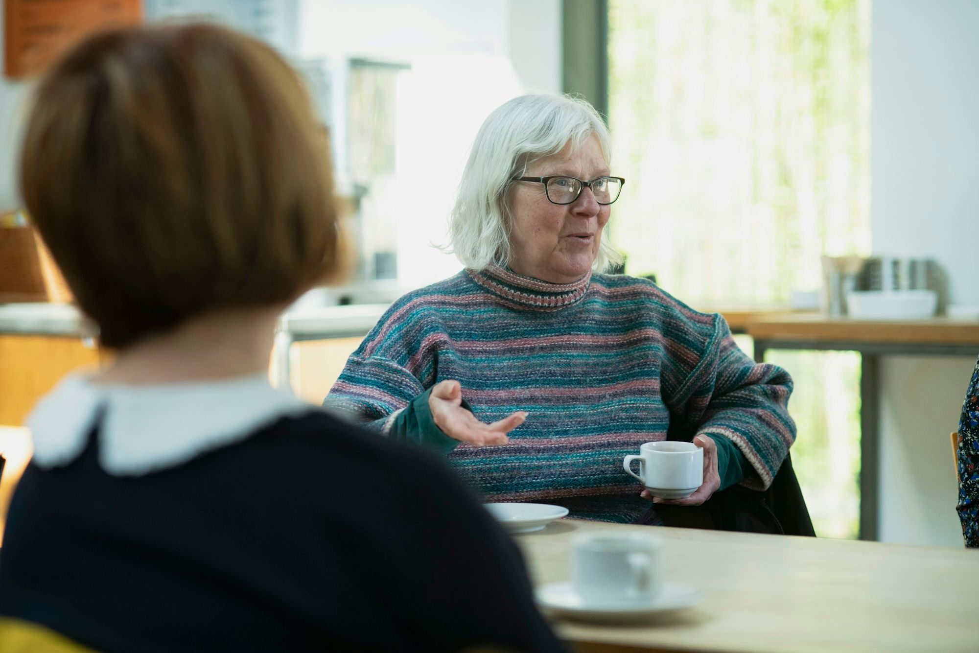 A family in conversation during a therapy session.
