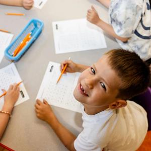 A Senesh first grader doing math homework in class.