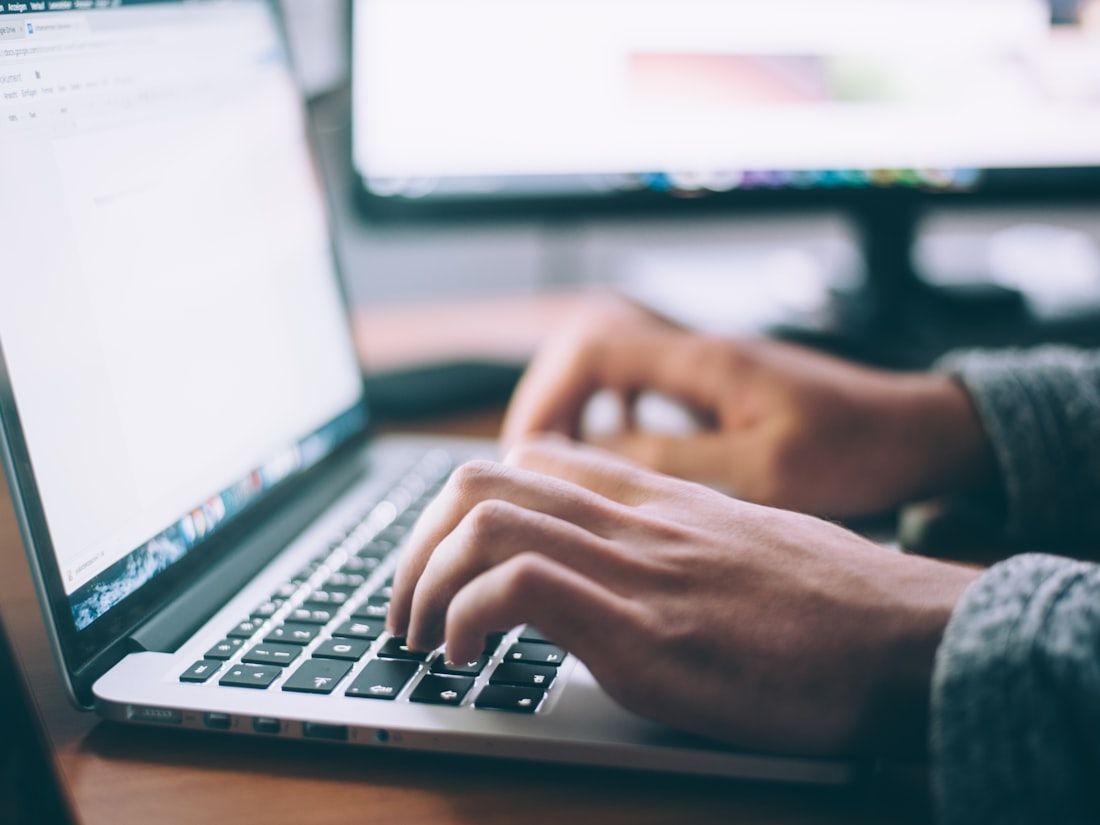 A self-employed professional working on a laptop