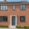 UK home with modern double glazed windows and an insulated front door after an energy efficiency upgrade.