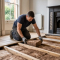 A professional installer fitting insulation between suspended timber floor joists in an older UK home during a 2026 retrofit survey.
