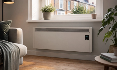 High heat retention electric storage heater with smart controls in a warm UK living room.