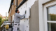Installer fitting external solid wall insulation to a British brick home for a warmer and more efficient property.
