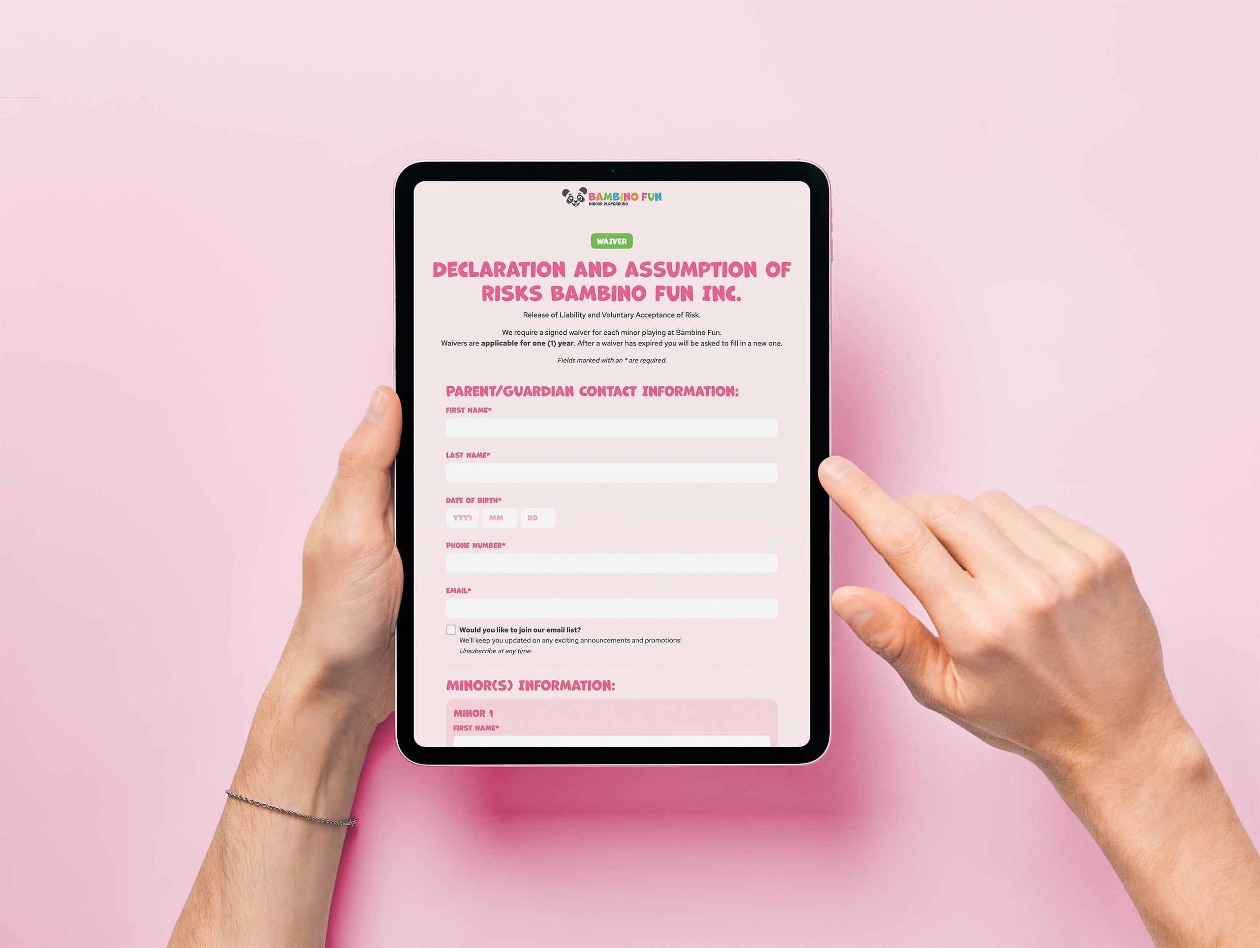 Person holding an iPad with the Bambino Fun waiver open which connects to internal tools for front-desk and admin managament.