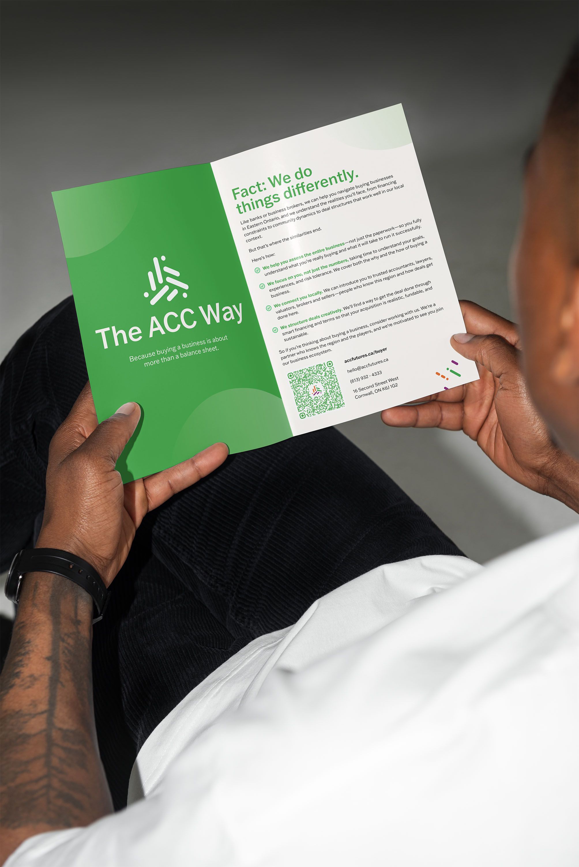 Person holding an ACCFutures booklet with it open to a page describing "The ACC Way"