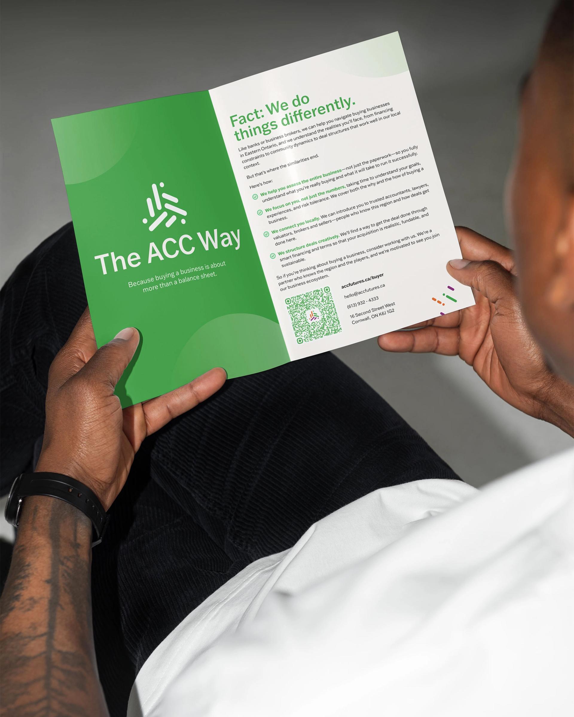 Person holding an ACCFutures booklet with it open to a page describing "The ACC Way"
