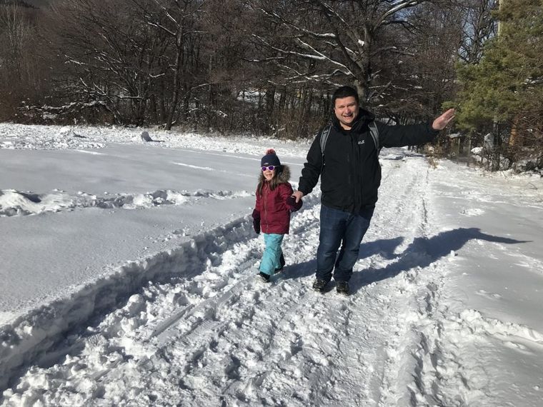 man-and-girl-walking-in-snow