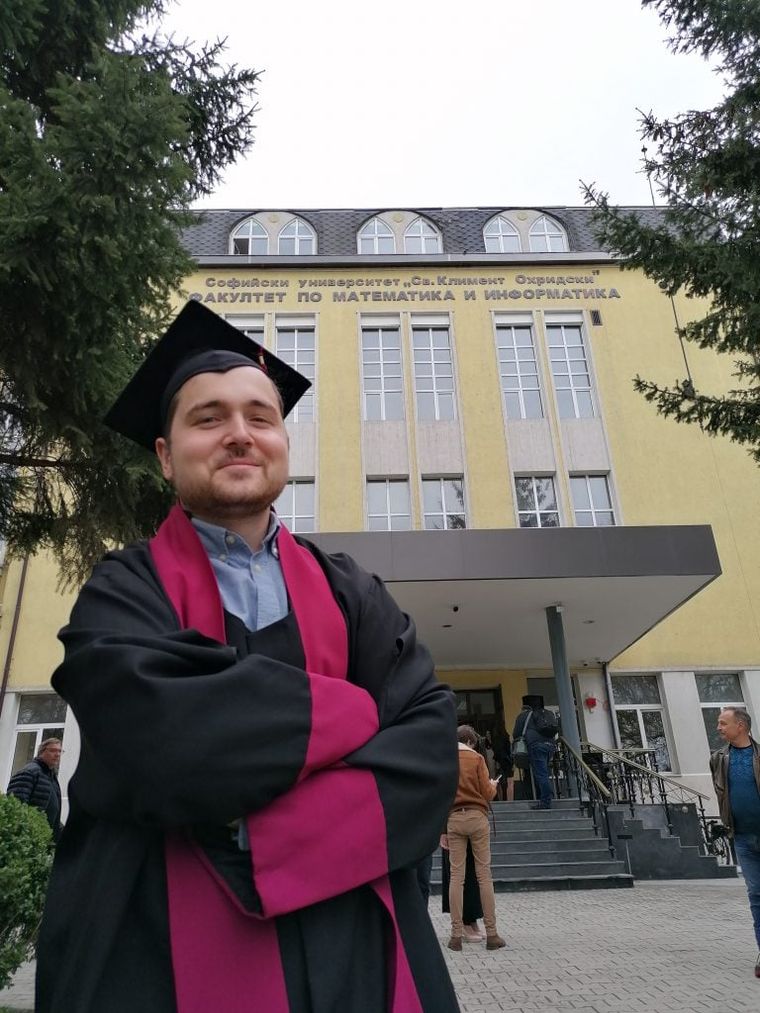 smiling-young-man-in-graduation-outfit