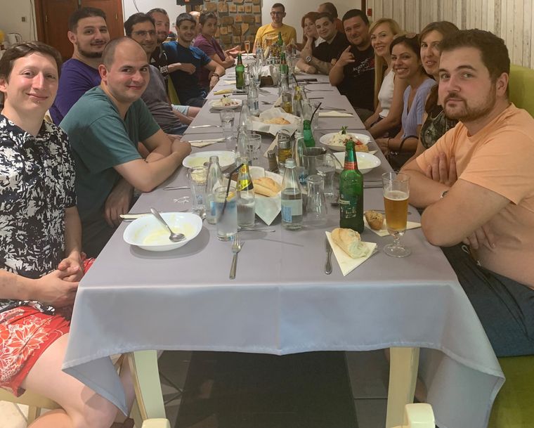 group-of-people-sitting-on-a-table
