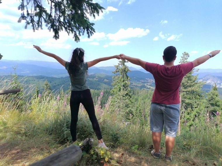 young-couple-facing-the-nature-ahead-of-them