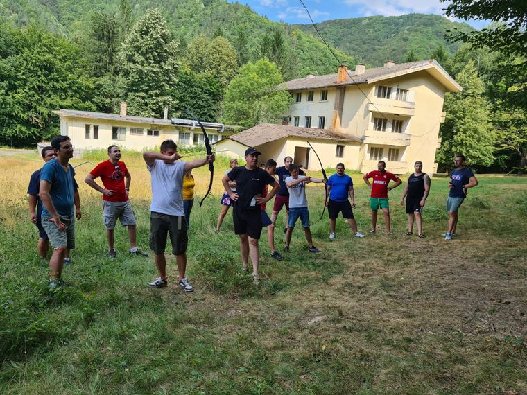 a-group-of-people-with-arrows