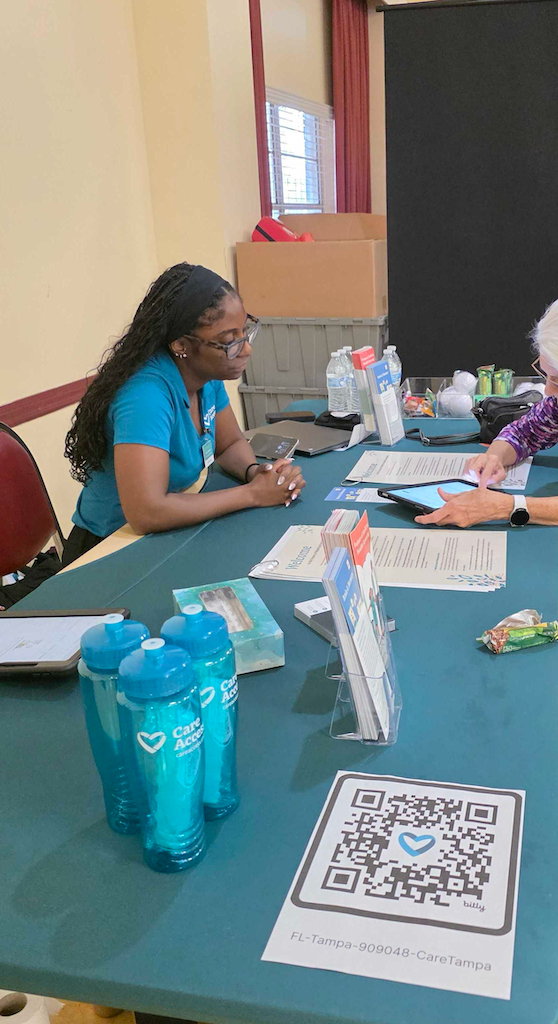 Care Access staff at community health screening event table