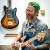 Photo du technicien guitares Jérôme Rabetaud jouant de la basse dans son atelier