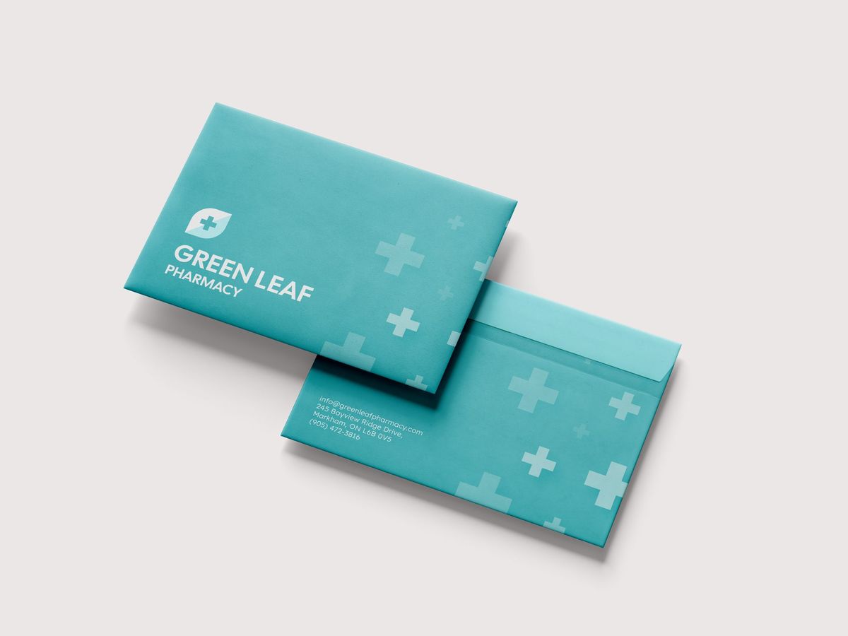 Branded teal envelopes with a logo and pattern, overlapping