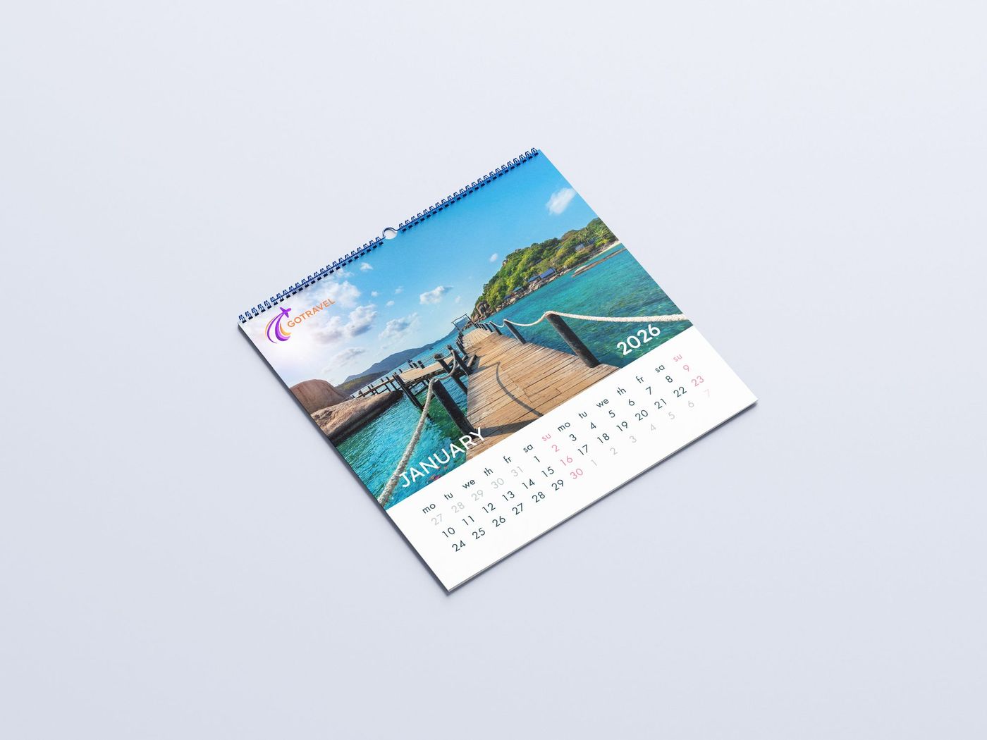 Spiral-bound wall calendar printed with a tropical photo