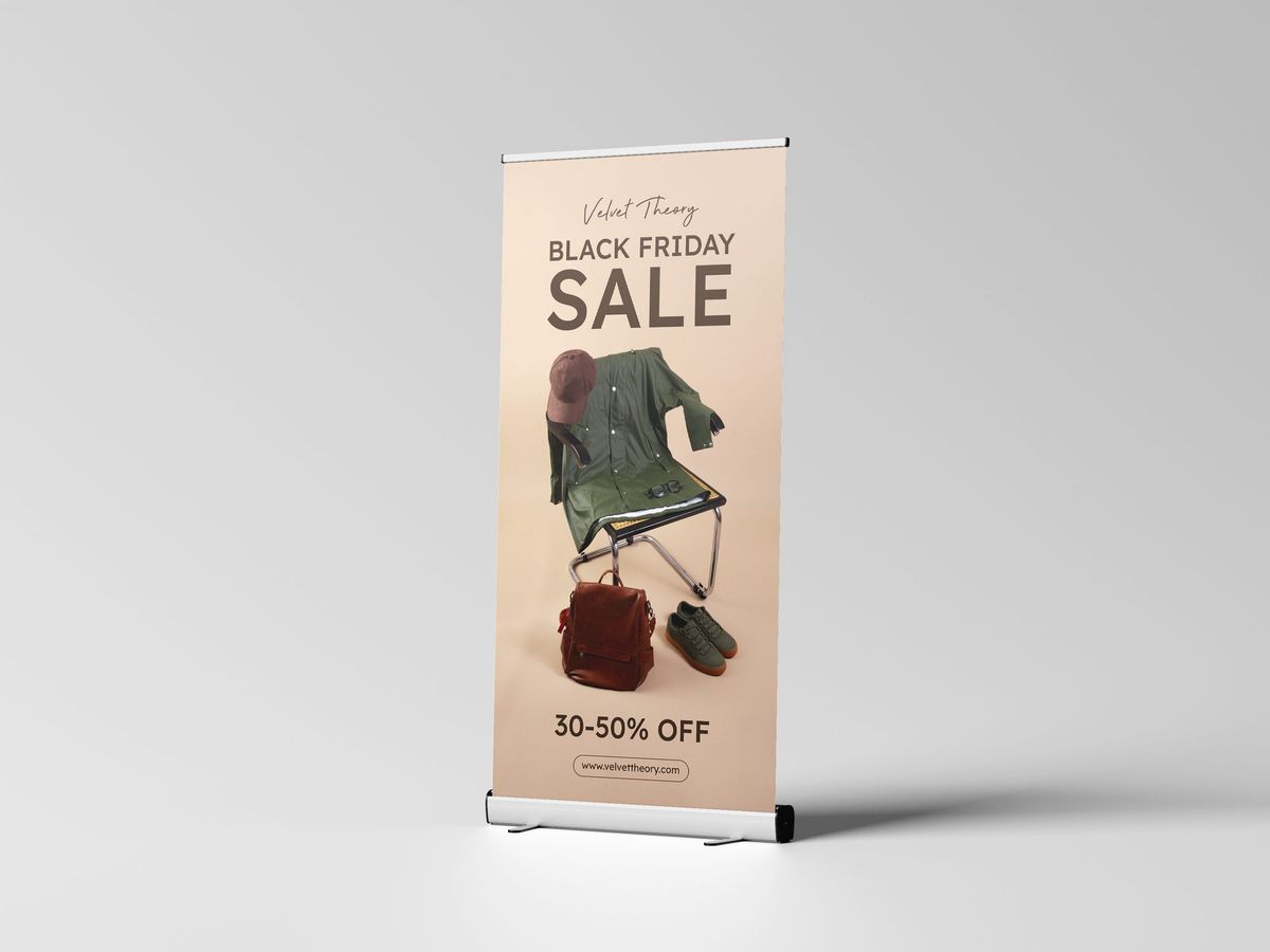 Roll-up banner stand with a retail sale promotion, side view