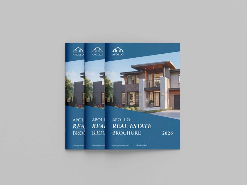 Stack of printed real estate brochures with glossy covers