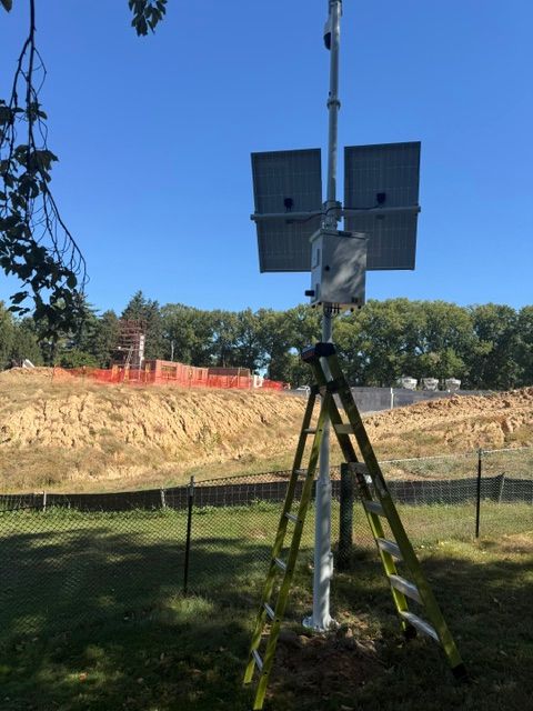Solar-powered security camera towers