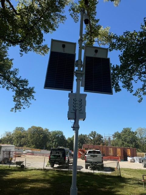Solar-powered security camera towers